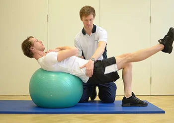 a man is receiving sports injury rehabilitation