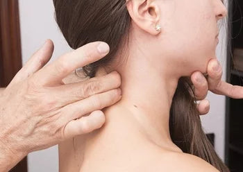 A women is receiving headache treatment