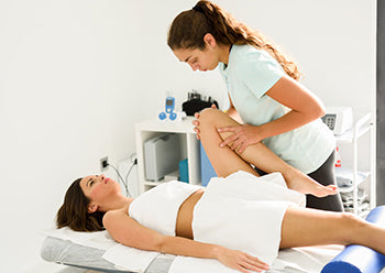 A women is receiving physical physiotherapy